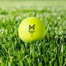 Yellow golf ball with dimple pattern and Member's Mark logo