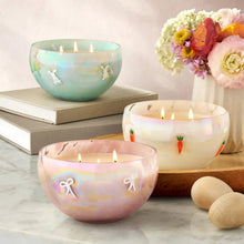 Turquoise glass 3-wick candle with bunny icon on the frosted bowl