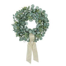 Eucalyptus wreath with dense blue-green leaves and cream bow ribbon