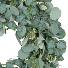Eucalyptus wreath detail with gray-green leaves and small white buds