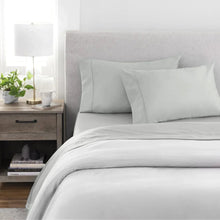 Light gray bed sheet set with two pillowcases and flat sheet