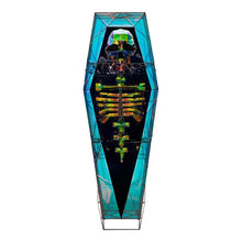 Back view of pre-lit prismatic coffin display with multicolor LED panels and skeleton