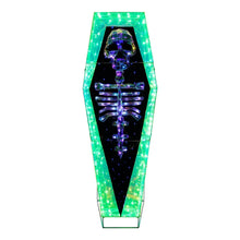 Front view of pre-lit prismatic coffin with green LED light outline and skeleton art