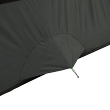 Cabin tent corner with black fabric wall and guyline stake connection