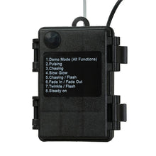 Black LED light controller box with buttons and power cord