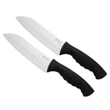 Pair of santoku slicing knives with white blades and black non-slip handles