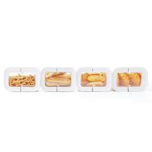Four small clear flip-lock snack containers arranged in a row, filled with dry foods
