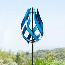 Blue scroll wind spinner with looping metal ribbon blades on a tall stake