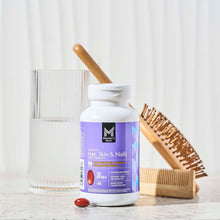 Member's Mark Advanced Hair, Skin & Nails softgels bottle with softgels beside on countertop