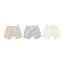 Three-pack baby bloomer shorts in light beige and off-white knit cotton, bow front