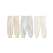 Three-pack infant rib pants, cream and light gray, elastic waist with cuffed legs.