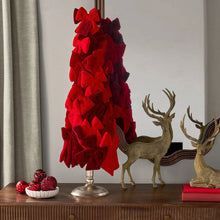Red bow tree decor with velvet bows on brass-toned stand