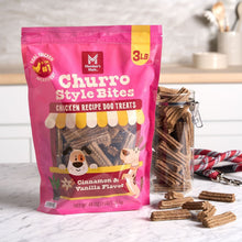 Pink pouch of chicken churro-style dog treats with cinnamon and vanilla, plus treat pieces