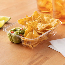 Clear two-compartment nacho tray with nacho chips and salsa-style toppings.