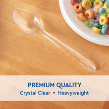 Clear plastic spoon on tabletop with glossy transparent finish