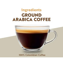 Cup of dark ground coffee with visible ingredients text and 100% Colombian Coffee