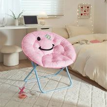 Pink smiley face folding saucer chair with cushioned ring seat and light blue metal frame