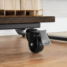 Desk caster wheel under dark brown shelf, with black metal bracket