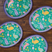 Set of oval paper plates with green Easter pattern and purple rims