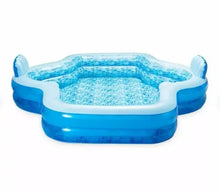 Inflatable family pool with blue side walls and four corner armrest bumps