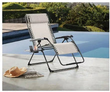 Oversized anti-gravity recliner chair with light fabric and black metal frame