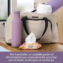 Facial cleansing towelettes packet among tote bag items with a folded wipe