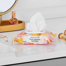 Facial cleansing towelettes packet with white wipe on a countertop