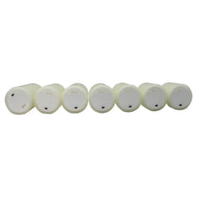 Set of seven white flameless LED wax candles with small black LED lenses