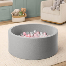 Gray foam ball pit with pink and white balls, shown from side