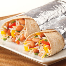 Aluminum foil-wrapped food wrap with vegetables on a serving tray
