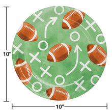 10-inch football-themed paper plate in green with footballs, arrows, and Xs pattern