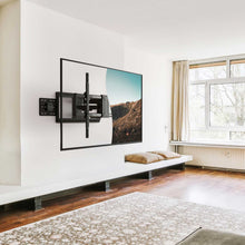 Full-motion TV wall mount with dual swivel arms mounted on wall