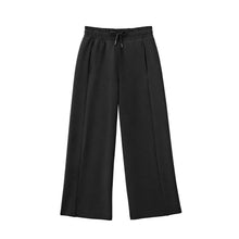 Girls sandwash pants front view, dark black wide-leg with adjustable drawcord