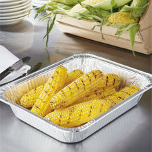 Disposable aluminum steam table pan filled with grilled corn on the cob