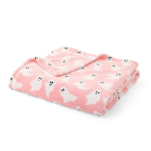 Folded pink Halloween ghost lounge throw blanket
