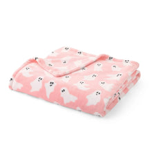 Pink ghost print lounge throw blanket folded, soft plush texture