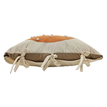 Decorative accent pillow side view with orange pumpkin top and beige ribbon bows