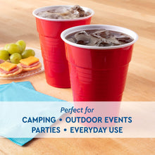 Red disposable party cups with ice and beverages, two cups shown.