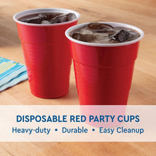 Two red disposable plastic party cups filled with ice