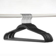 Set of rubberized hangers stacked, dark gray/black finish with metal hook