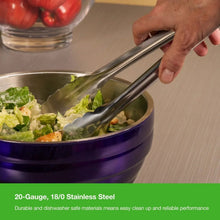 Heavy duty utility tongs serving salad from a saucepan, silver