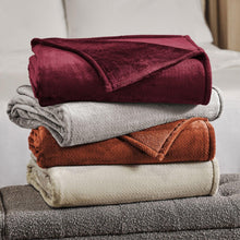 Herringbone velvet plush blanket, burgundy, folded stack shown with gray and tan blankets