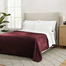 Herringbone velvet plush blanket, burgundy, covering bed with smooth, folded drape