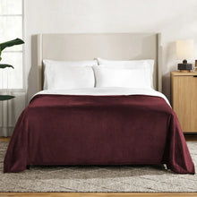 Herringbone velvet plush blanket, burgundy, draped across bed with soft folds