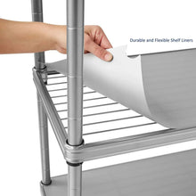 Flexible white shelf liner being placed on a wire shelf inside the unit