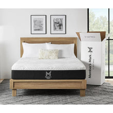 Memory foam mattress on wooden bed frame with shipping box