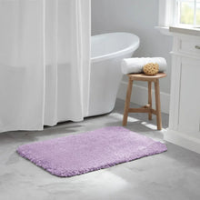 Lilac soft bath rug, rectangular, placed on bathroom floor