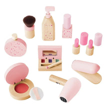 Assorted pink and wood pretend makeup set for kids vanity, including brush and bottles