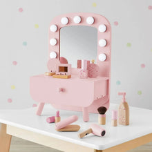 Pink kids vanity set with round bulb mirror, drawer sink, and pretend cosmetics