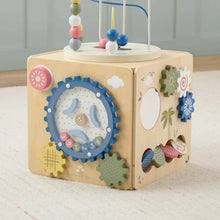 Wooden activity cube with blue gear window, bead maze, and leaf and cloud cutouts
